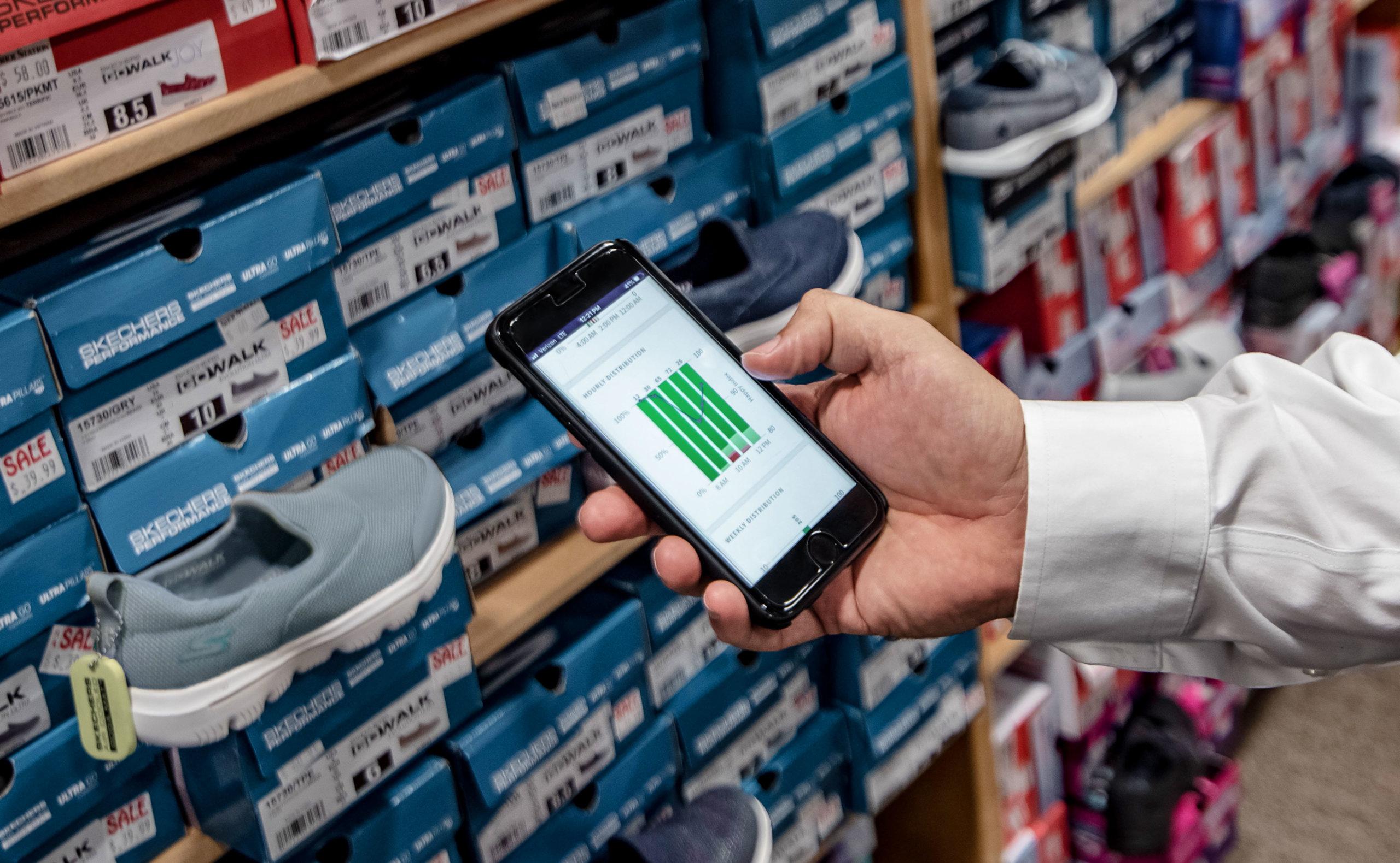 HappyOrNot mobile reporting app in use by Shoe Station