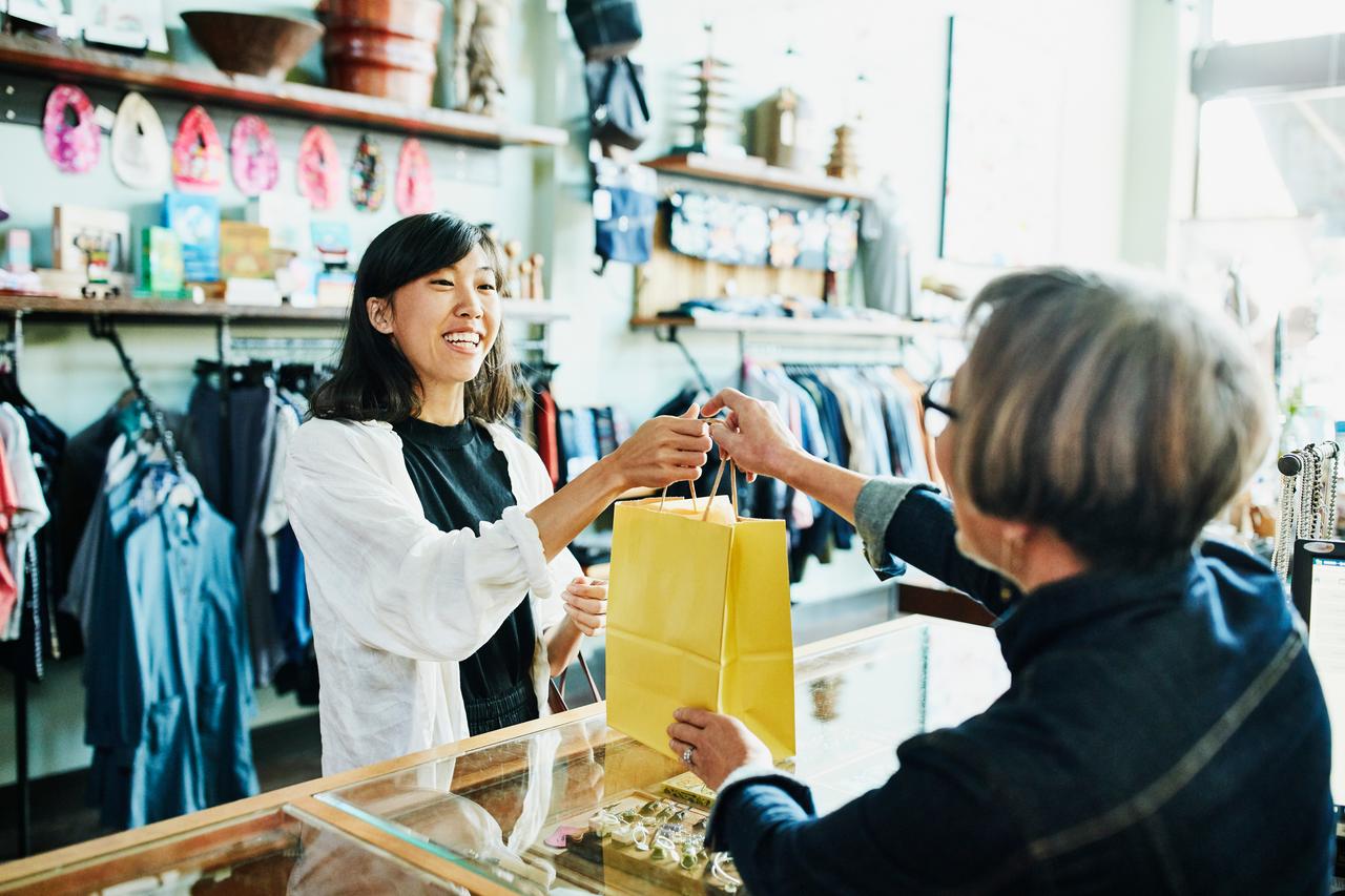 retail employee serving customer in store